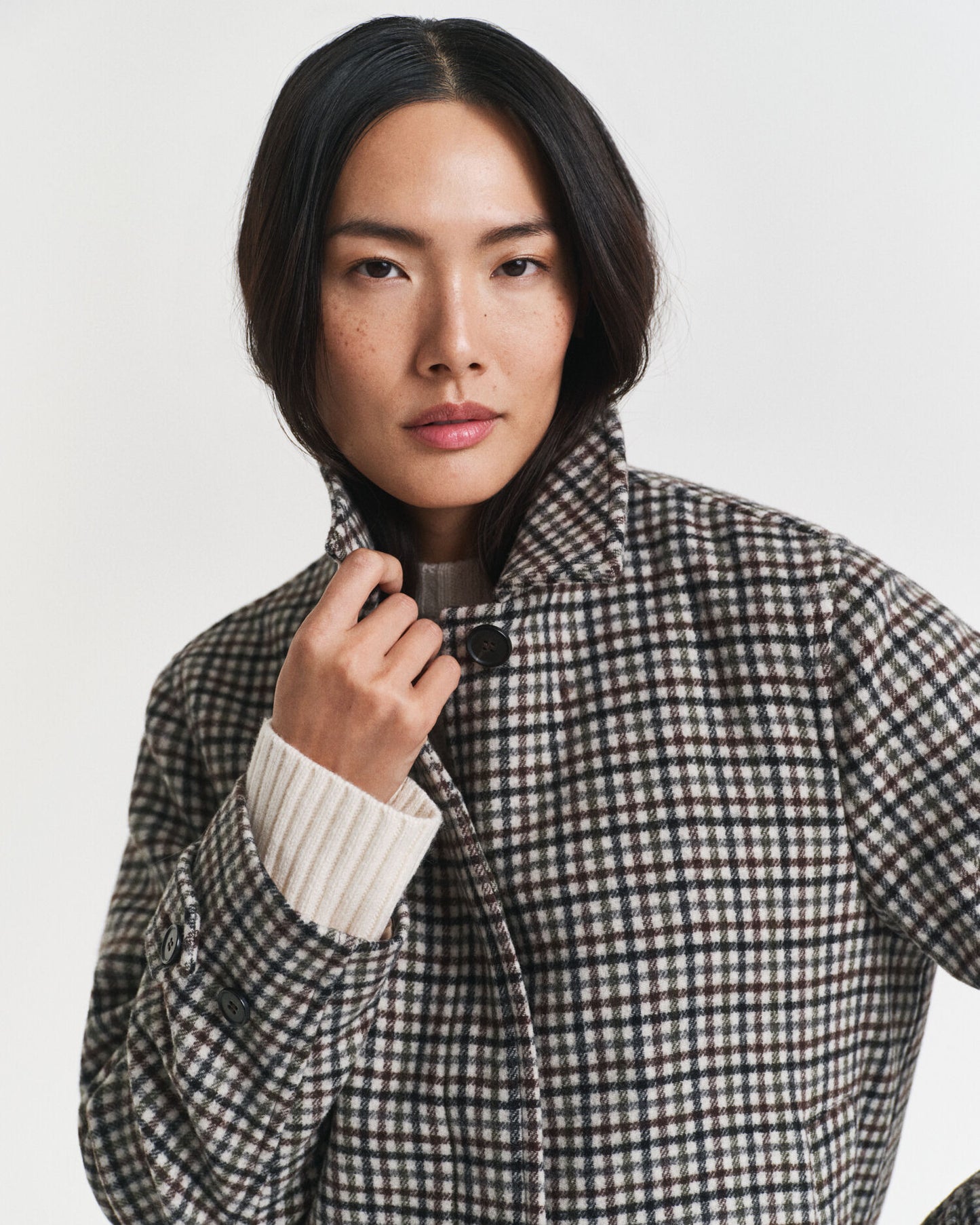 Manteau court en laine mélangée à carreaux